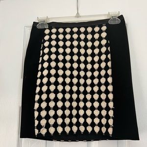 Faux leather waist trim black and cream design skirt.